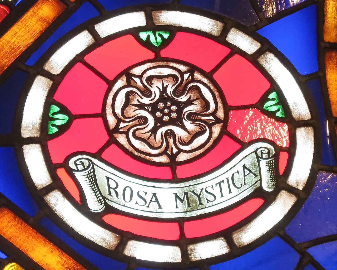 A stained glass rose window medallion